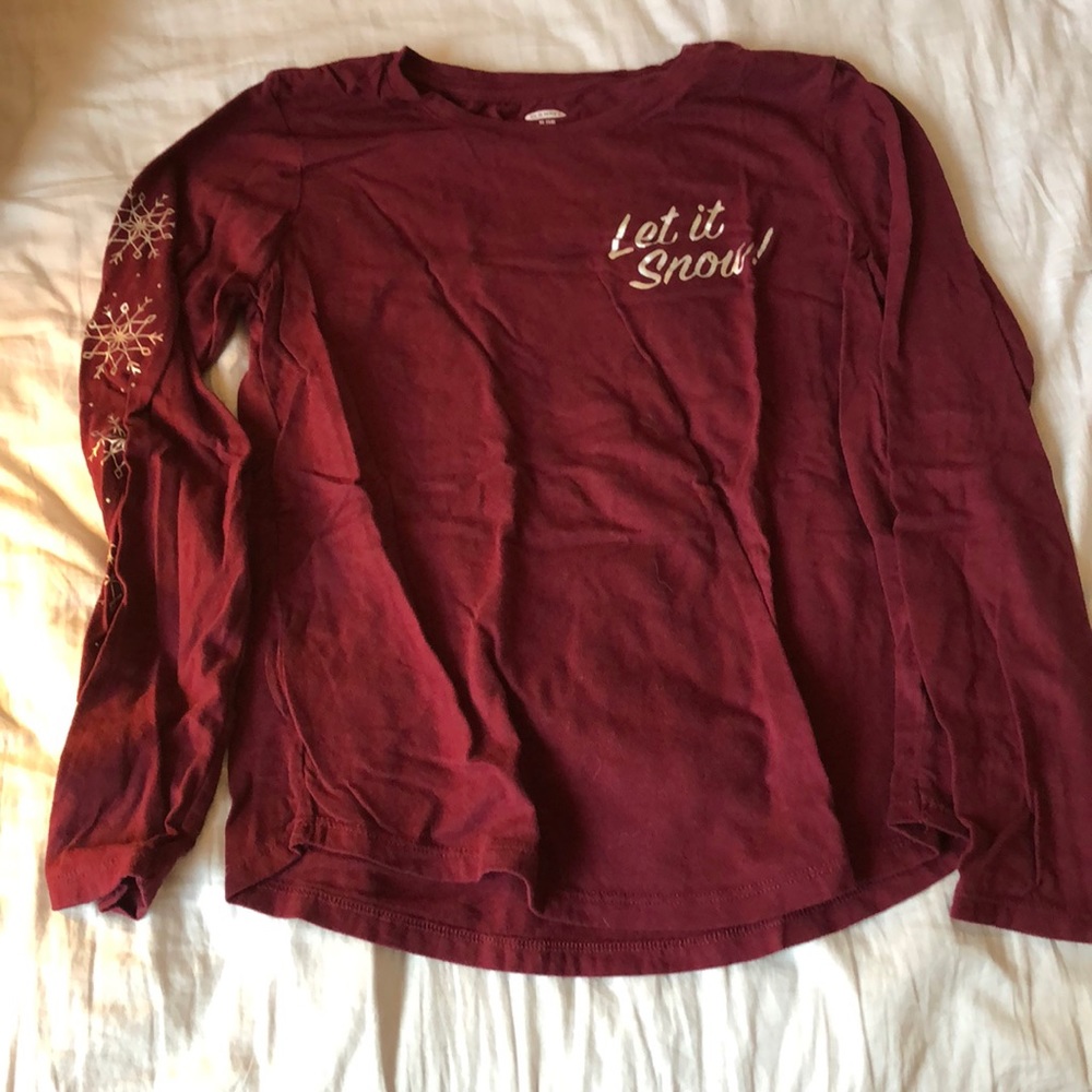 A “let it snow” maroon long sleeve shirt.